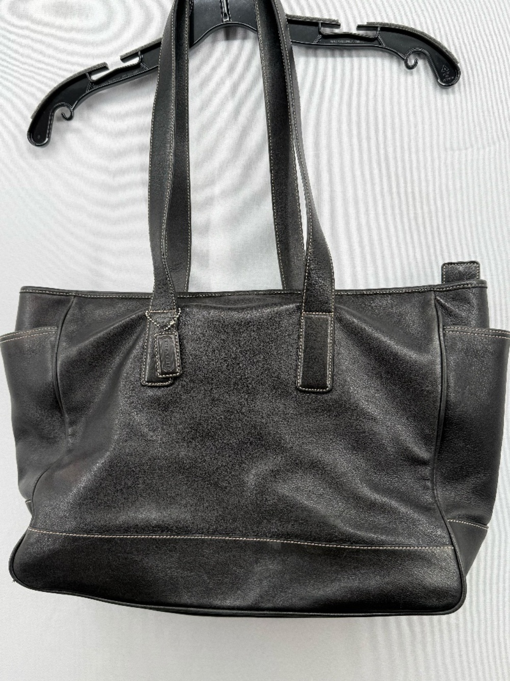 Classic Coach black leather large tote shoulder bag featuring contrasting stitch